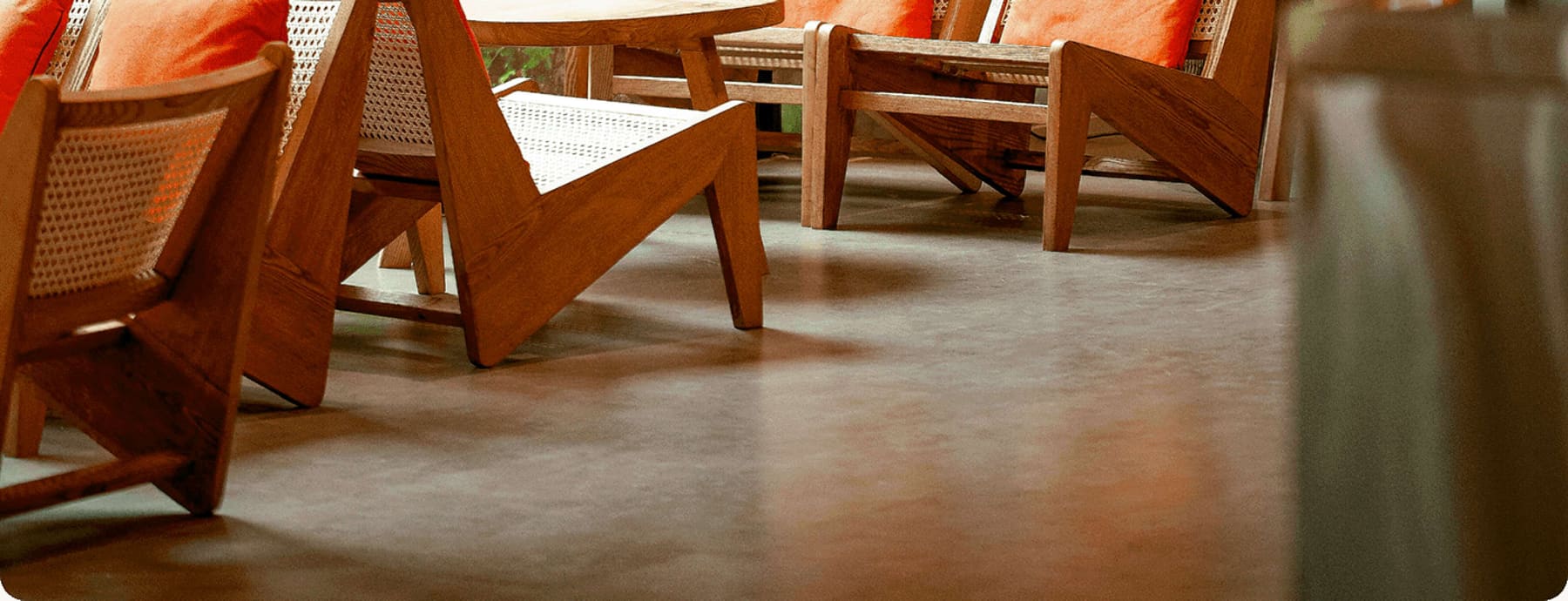 Warm wooden lounge chairs on a polished floor