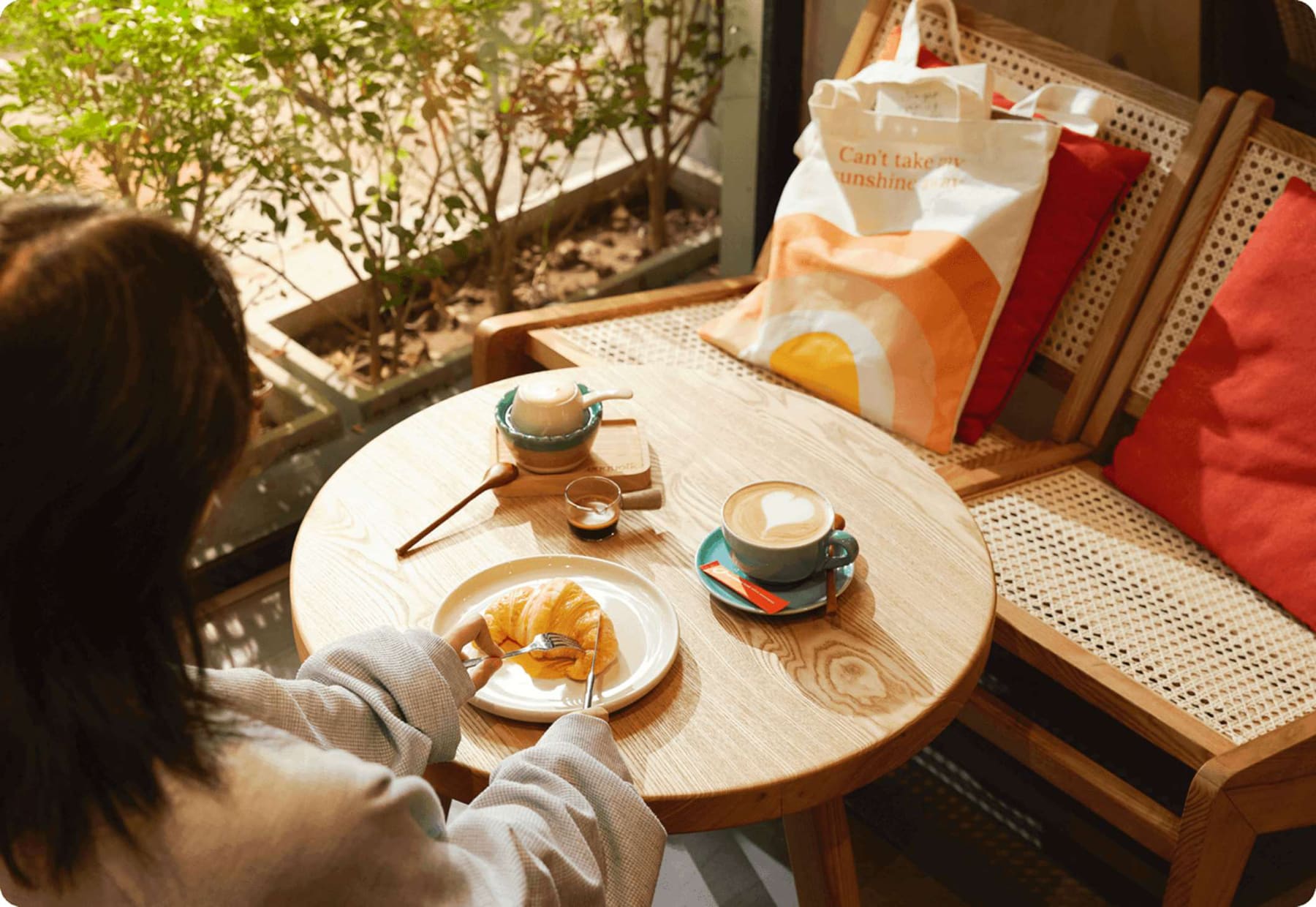 Morning coffee and a croissant on a sunny Eggyolk terrace